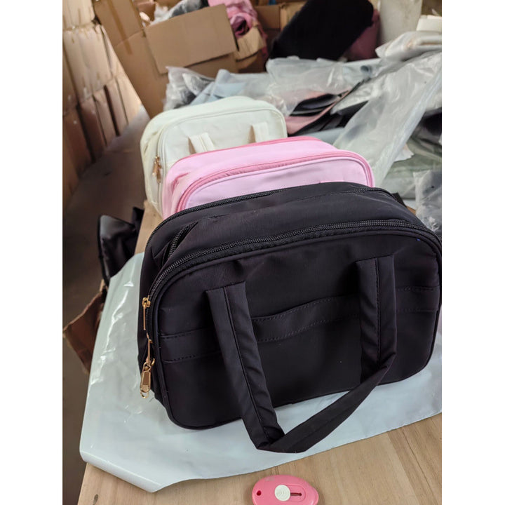 Cosmetic bag with padded interior compartment Stornfield