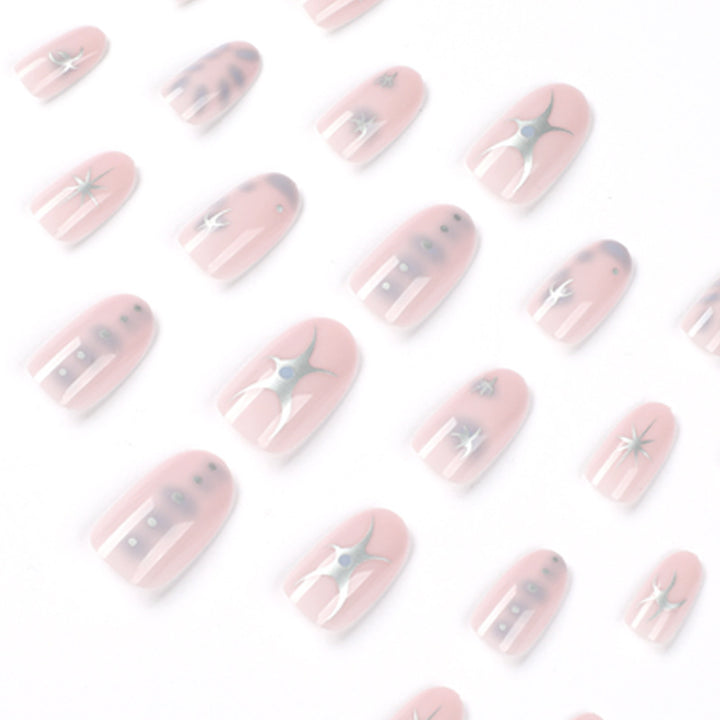 Elegant nail art with glamorous metal embellishments Stornfield