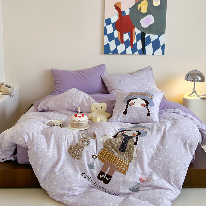 Bedding set with appliquéd doll motif and star pattern