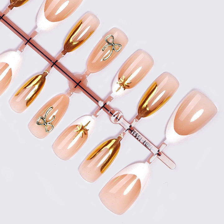 Artificial nail set with glamorous 3D details and elegant gold accents Stornfield
