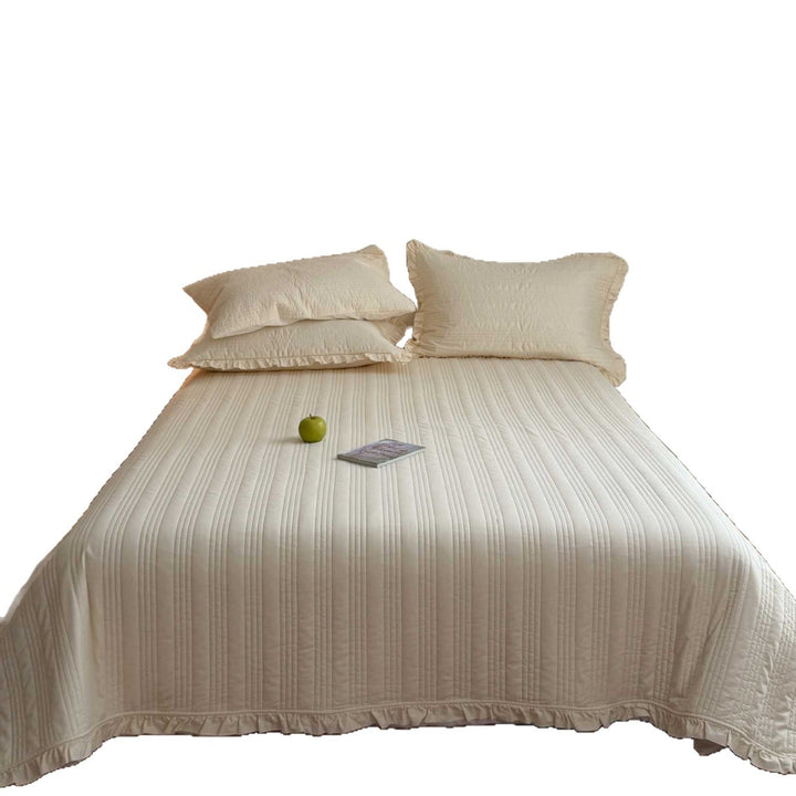 Quilted bedspread with frill and fine line quilting made of cotton blend fabric