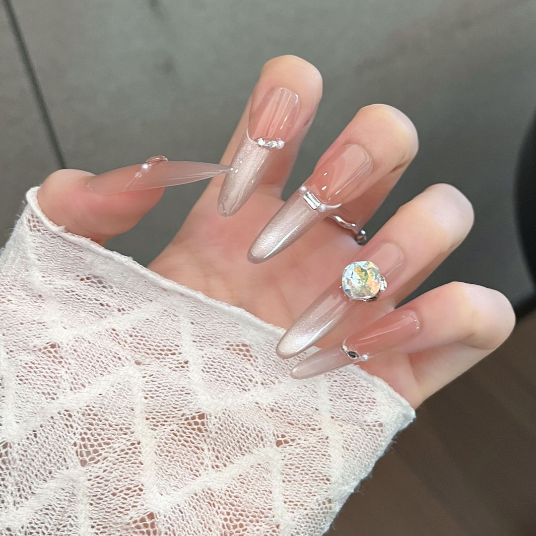 Artistic Stiletto Press-On Nail Art with Glimmering Accents Stornfield