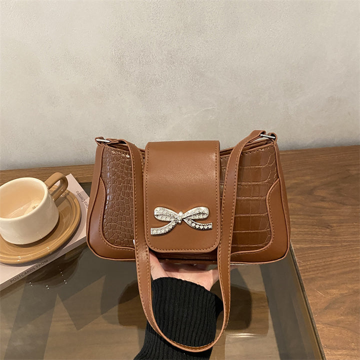 Elegant Crocodile-Patterned Handbag with Bow Detail