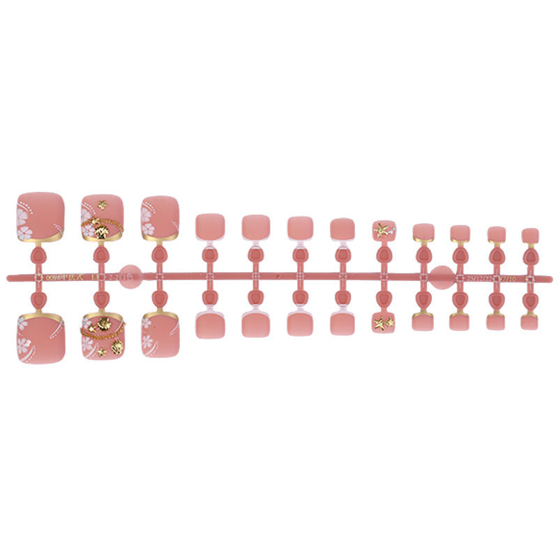 Acrylic nail set with exquisite floral accents and golden embellishments Stornfield