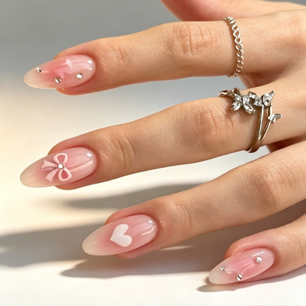Artificial nails with romantic heart and bow design Stornfield