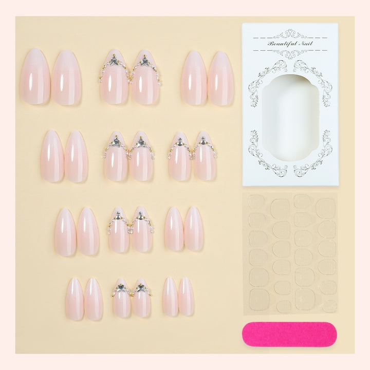 Acrylic nail set with elegant rhinestone decorations and glamorous designs Stornfield