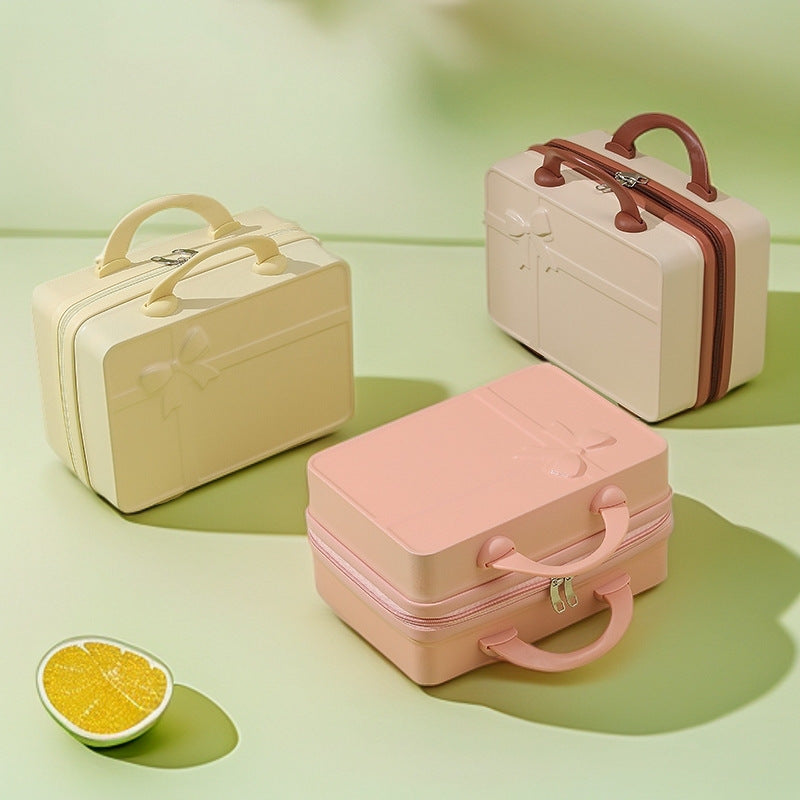 structured hard-shell cosmetic travel case with embossed bow and dual top handles Stornfield