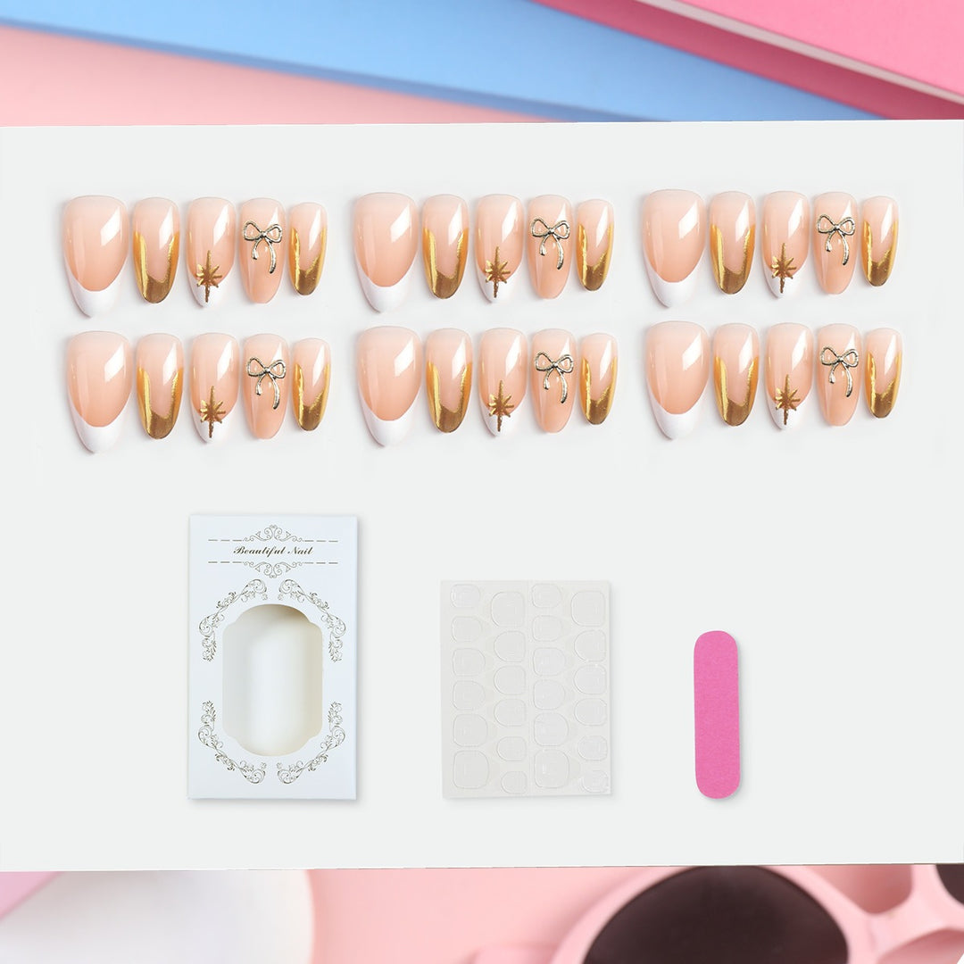 Artificial nail set with glamorous 3D details and elegant gold accents Stornfield