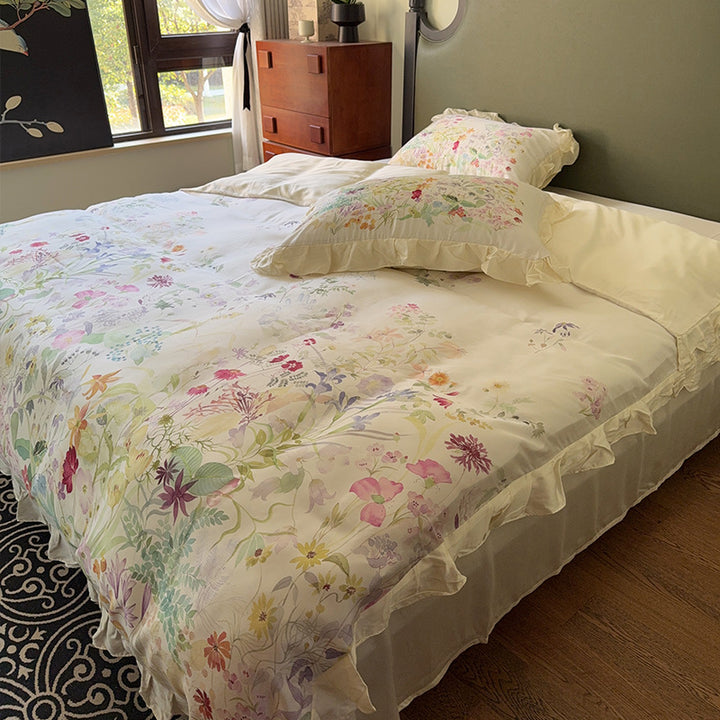 Cotton satin bed linen set with delicate watercolor botanical print and decorative ruffle