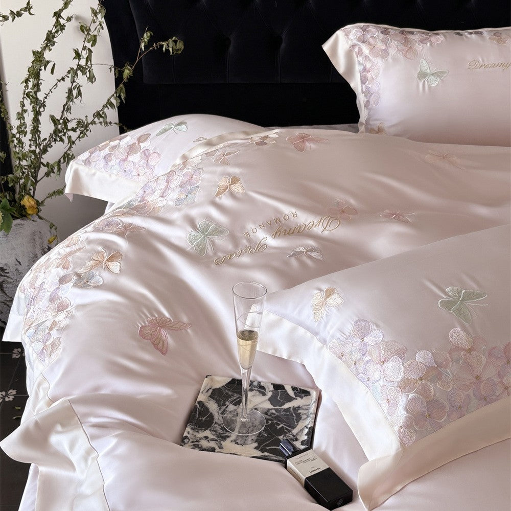 Luxurious satin bedding set with embroidered butterfly and flower appliqués