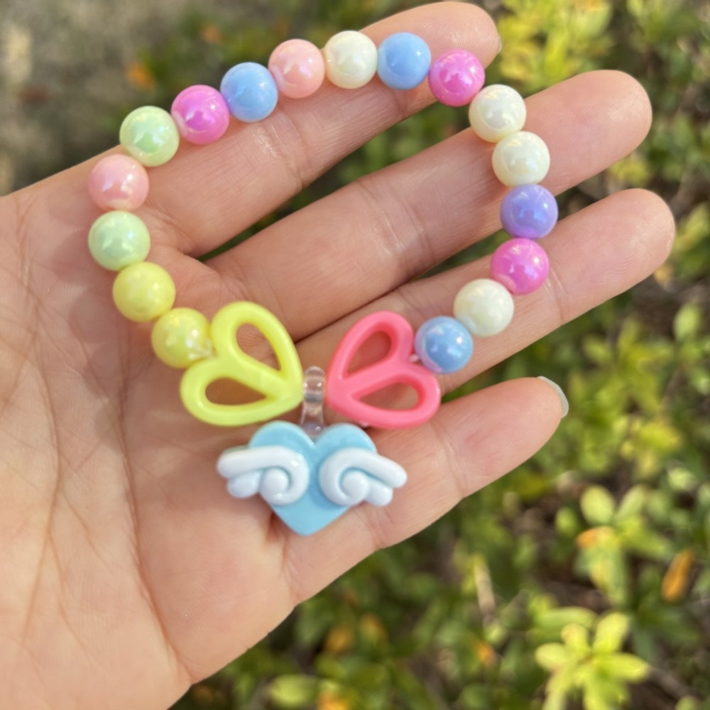 Colorful bracelet with flower charms Stornfield