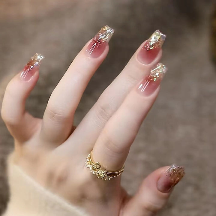 Stylish art false nails with heart design and glitter Stornfield