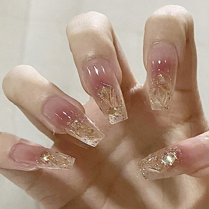Artificial nails with glamorous glitter accents Stornfield