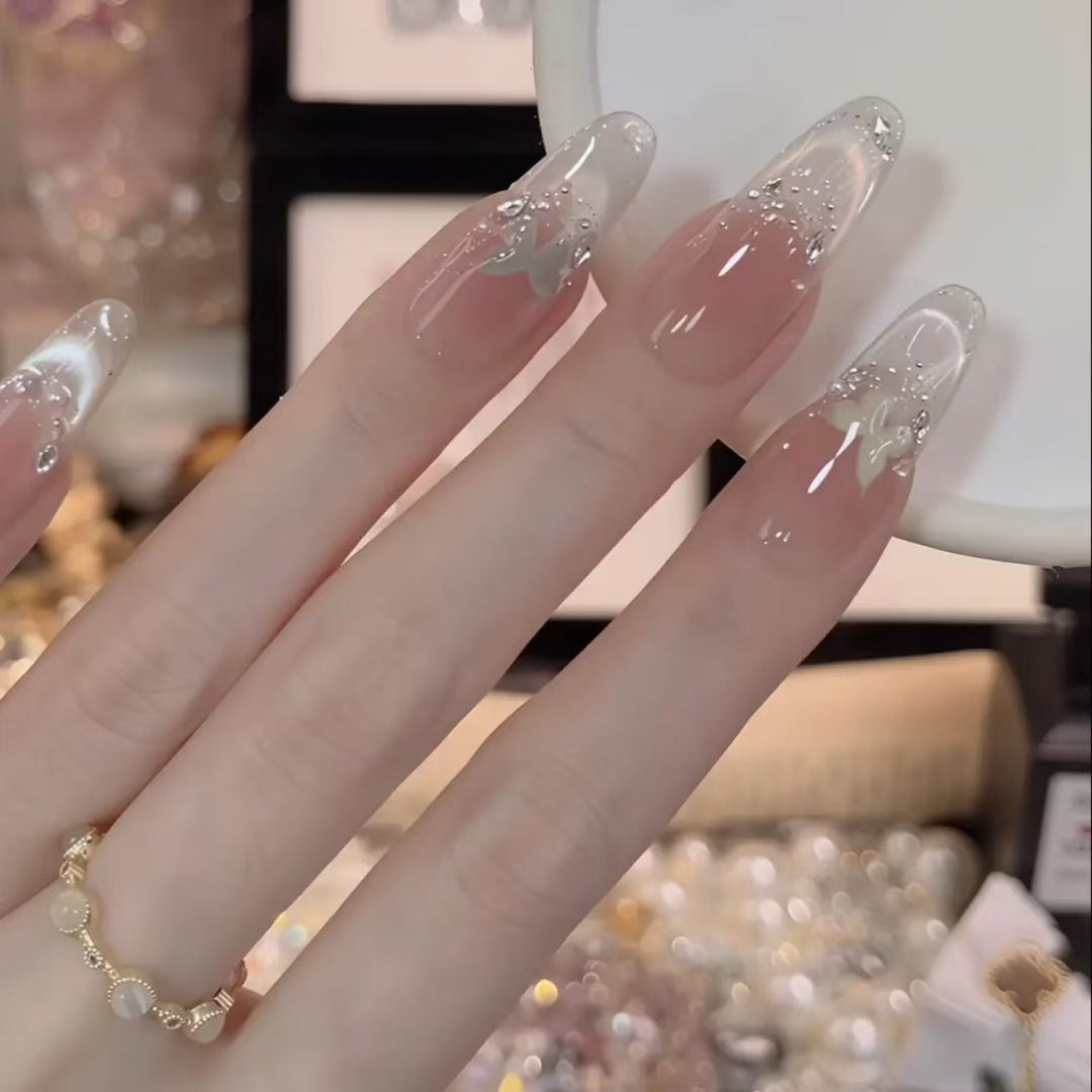 Elegant Acrylic Nail Extensions with Glitter Accents