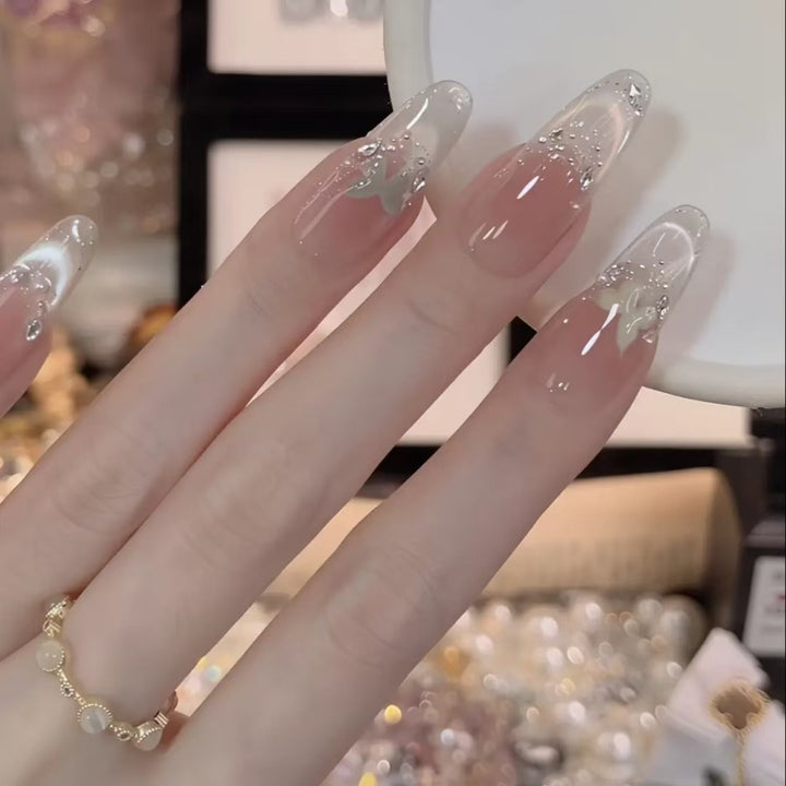 Elegant Acrylic Nail Extensions with Glitter Accents