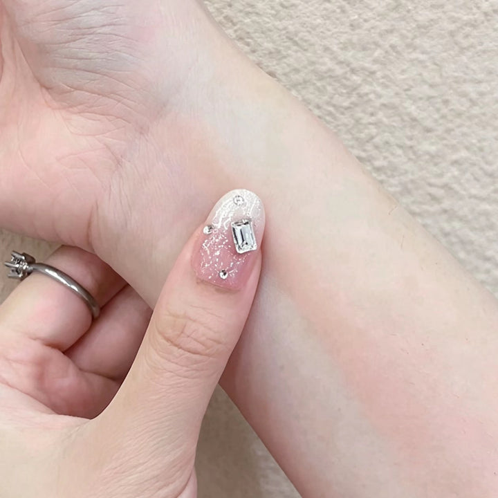 Glamorous Nail Art Extensions with Decorative Accents
