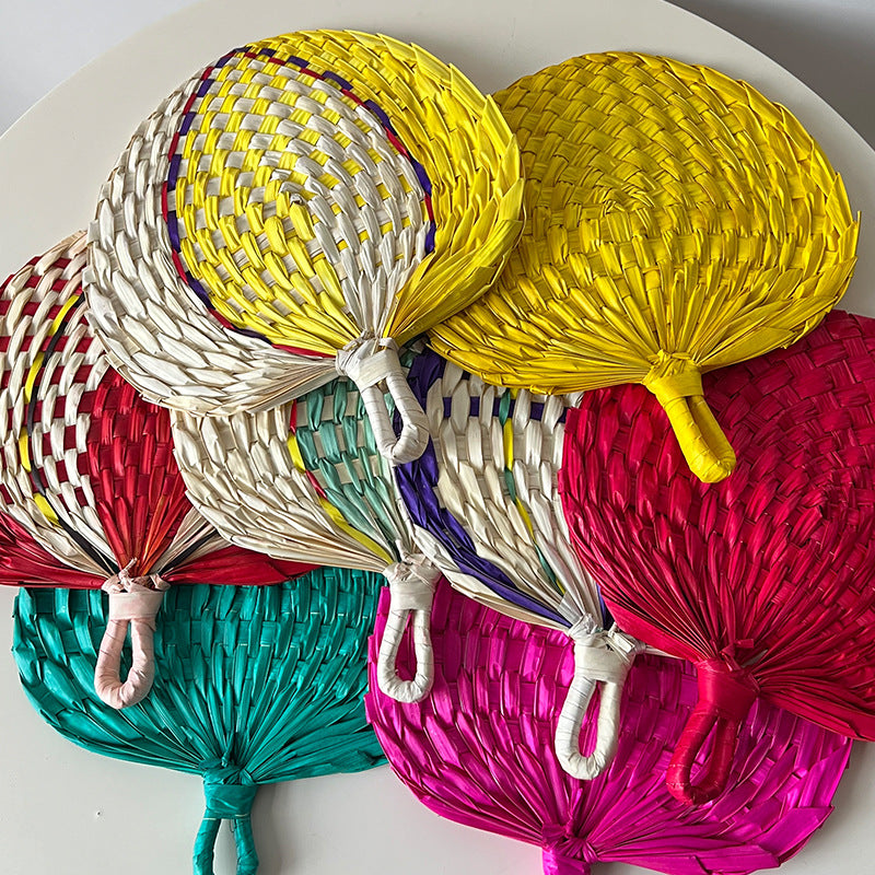 Women hand-woven fan made of natural material Stornfield