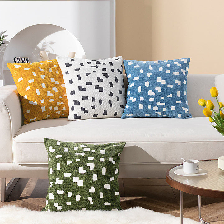 Decorative cushion with abstract pixel pattern and soft bouclé cover