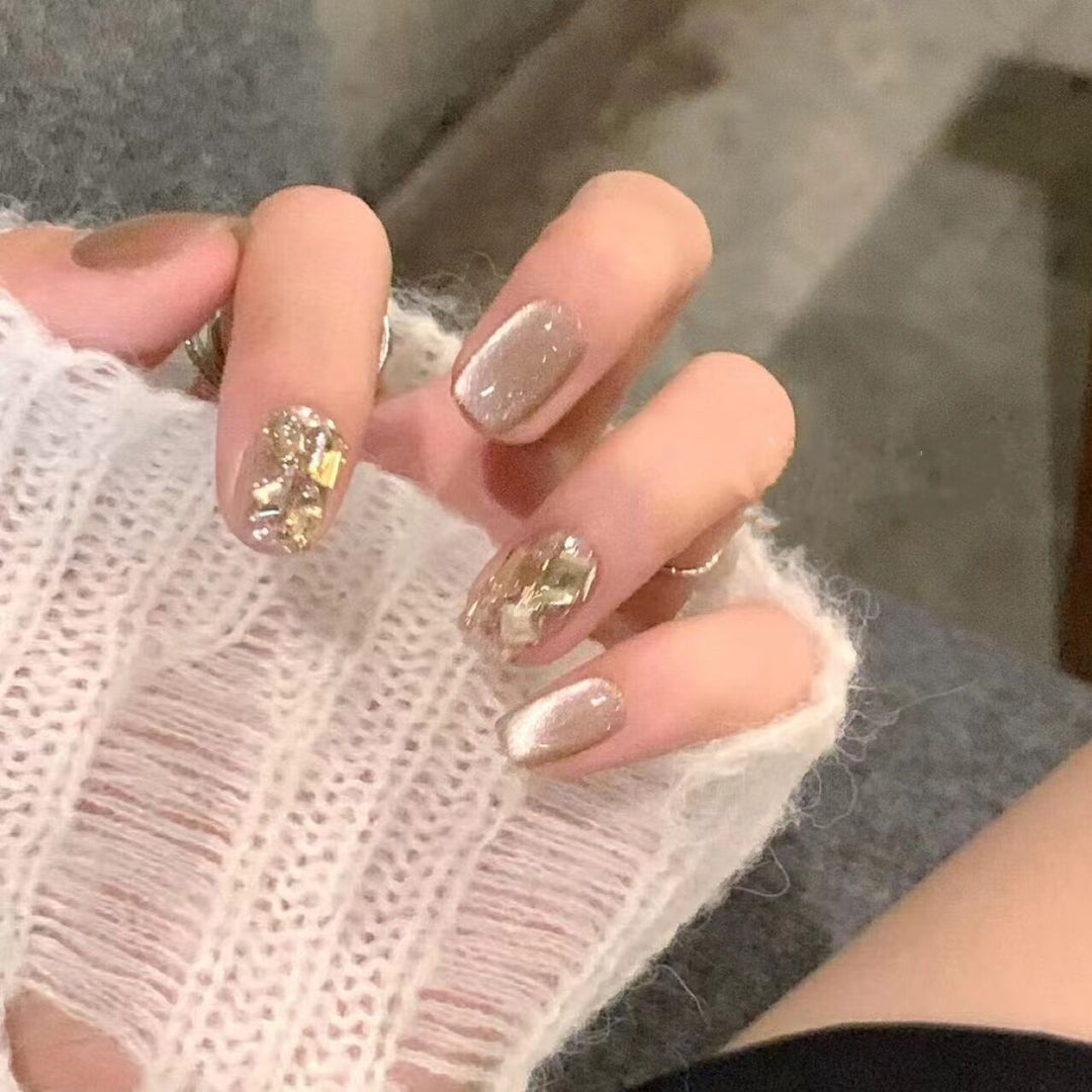Acrylic nail set with glamorous gold details Stornfield