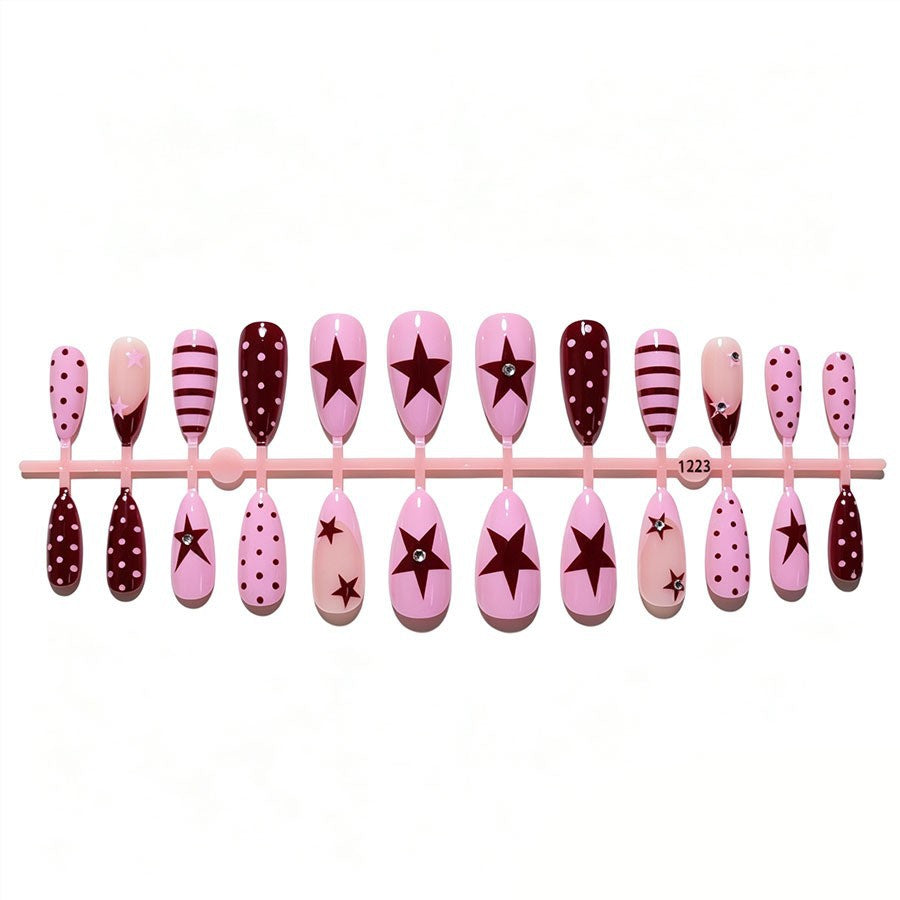 Artificial nail set with asymmetric designs and glitter accents Stornfield
