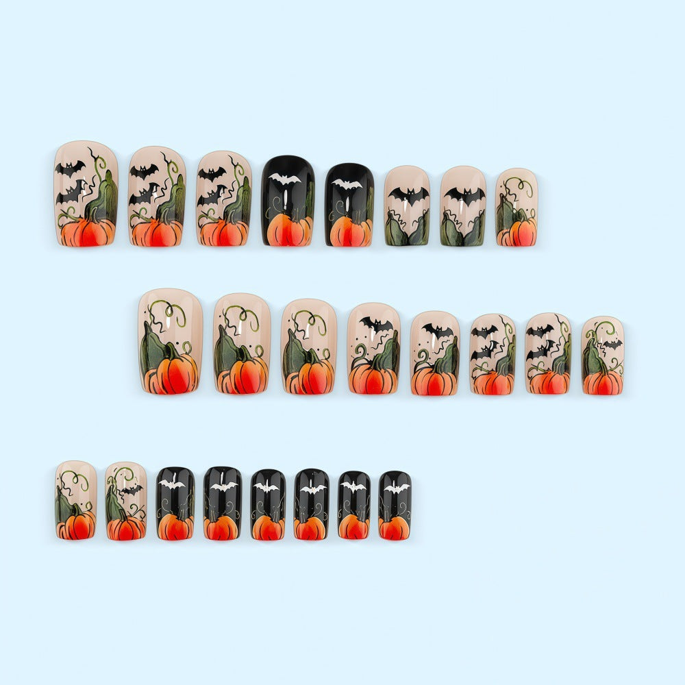 Artificial nails in Halloween design with pumpkins and ghosts Stornfield