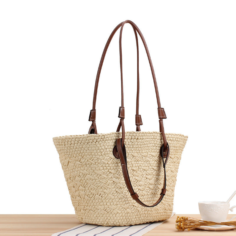 Beach bag made of handcrafted natural material with sturdy leather handle Stornfield