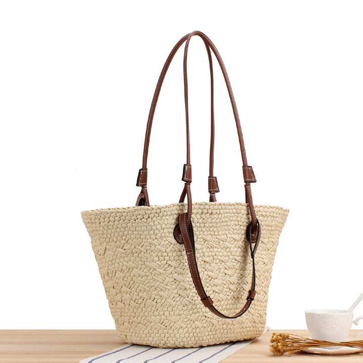 Beach bag made of handcrafted natural material with sturdy leather handle Stornfield
