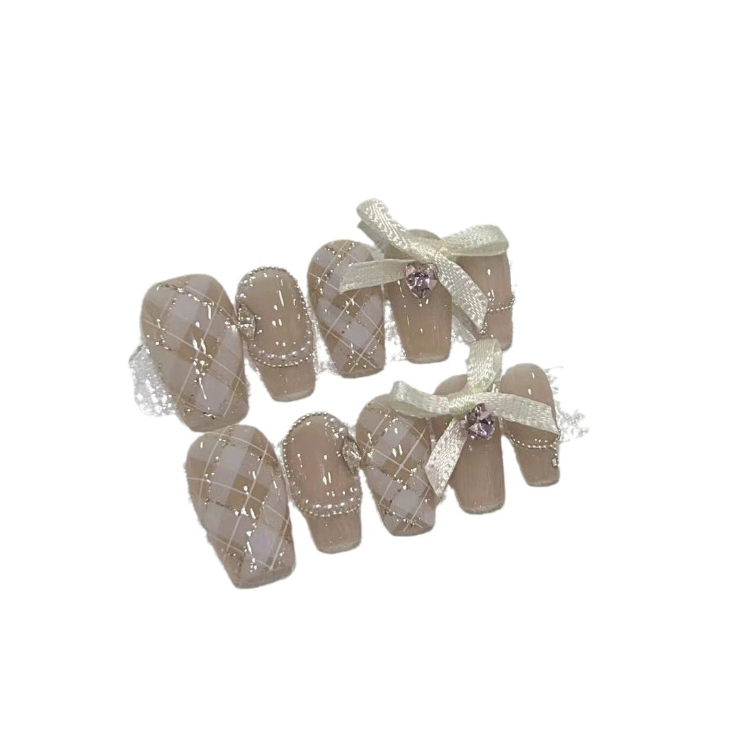 Elegant Press-On Nail Art Set with Ribbons and Gemstone Accents Stornfield