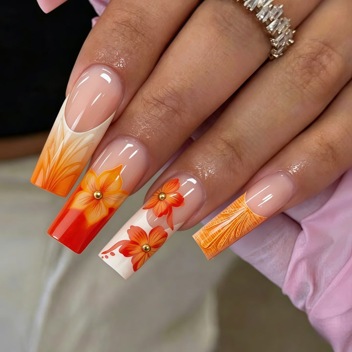 Nail art with floral accents and glitter Stornfield