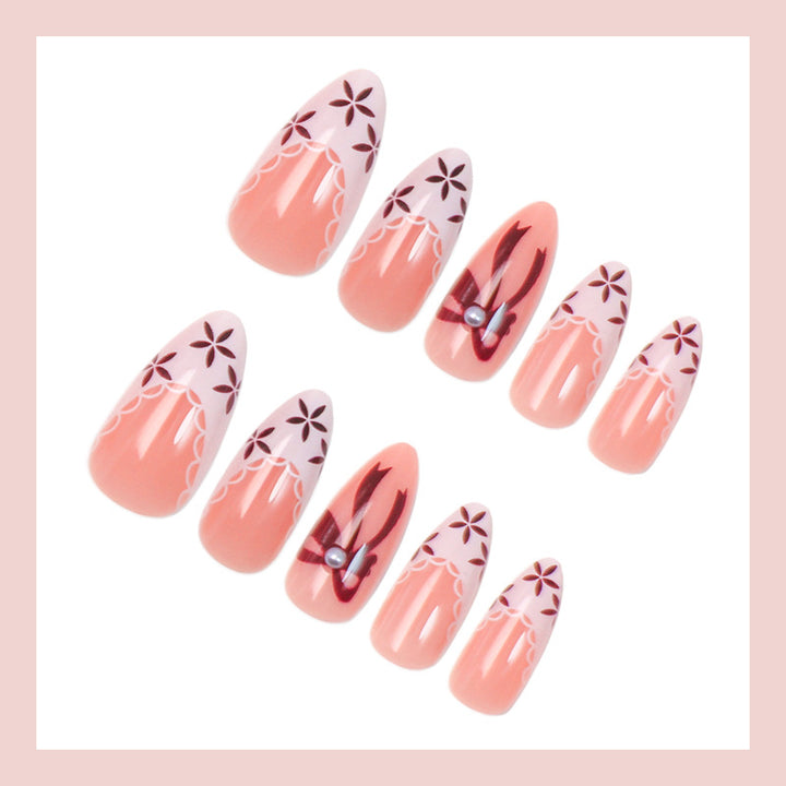 Artificial nail set with elegant bow and flower details Stornfield