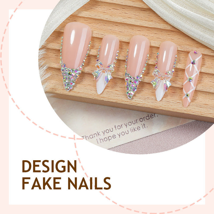 Acrylic nail set with luxurious rhinestone embellishments and bow accents Stornfield