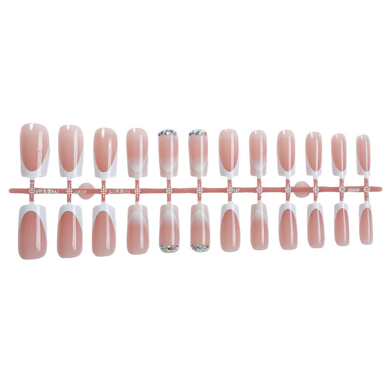 Artificial nail set with elegant ombre accents and seductive rhinestones Stornfield