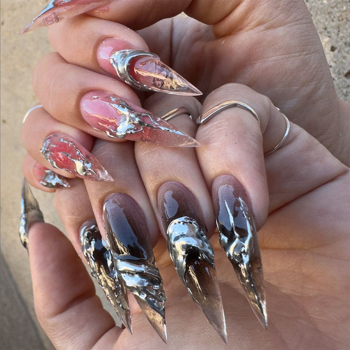 Creative stiletto nails with unique metallic details Stornfield