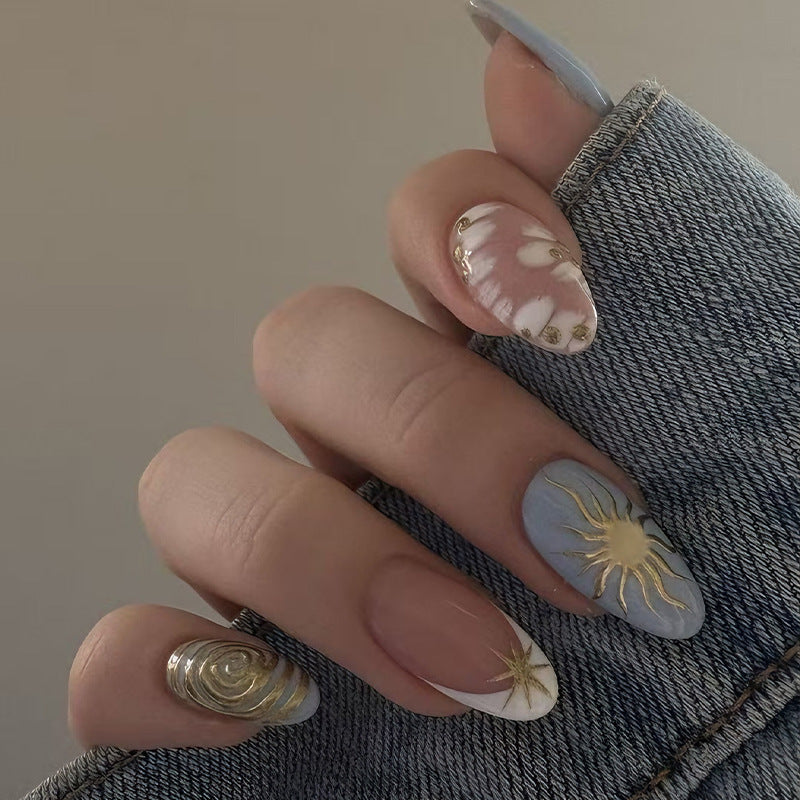 Nail art set with elegant gold accents and creative design Stornfield