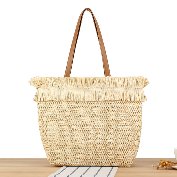 Beach bag made of handwoven natural material with fringe decoration Stornfield