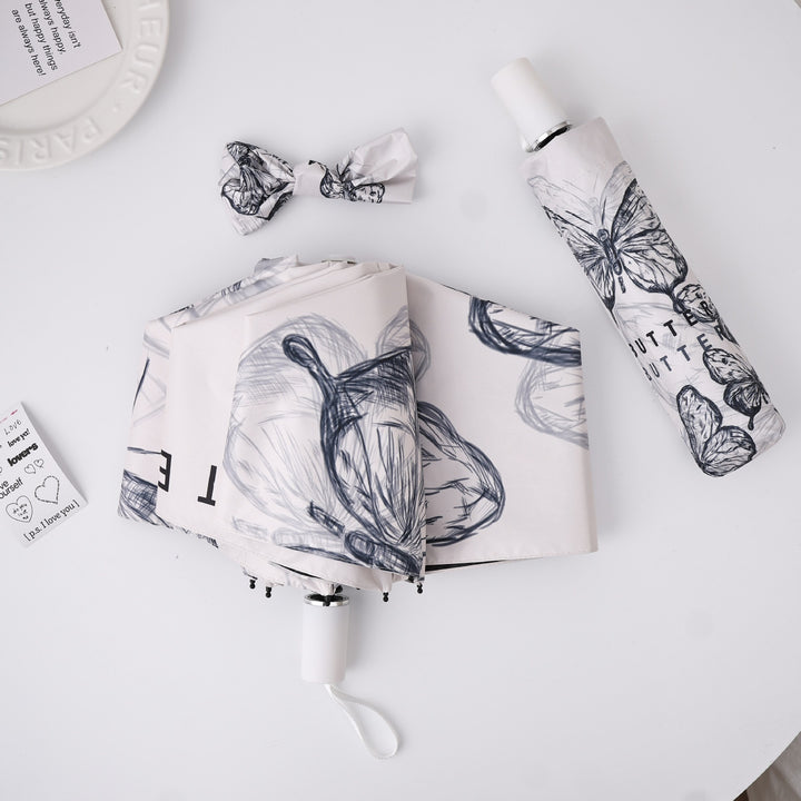 Women's fashionable folding umbrella with playful design Stornfield
