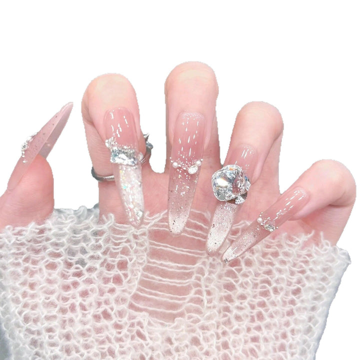 Artificial nails with glitter and crystal embellishments Stornfield