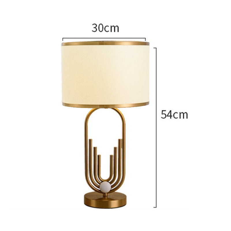 Artistic Table Lamp with Gold and Cream Features