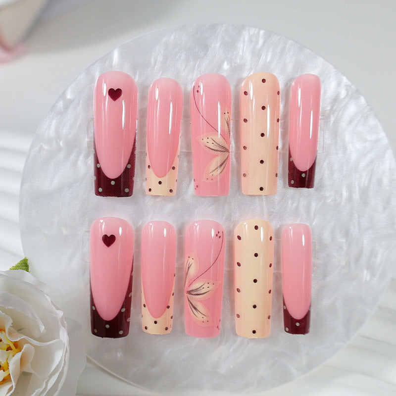 Acrylic nail set with elegant floral and polka dots design Stornfield