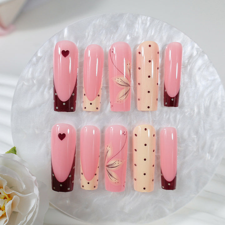 Acrylic nail set with elegant floral and polka dots design Stornfield