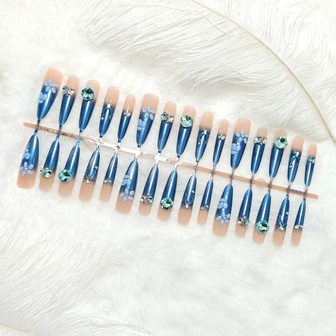 Elegant artificial nails with floral applications and glitter elements Stornfield