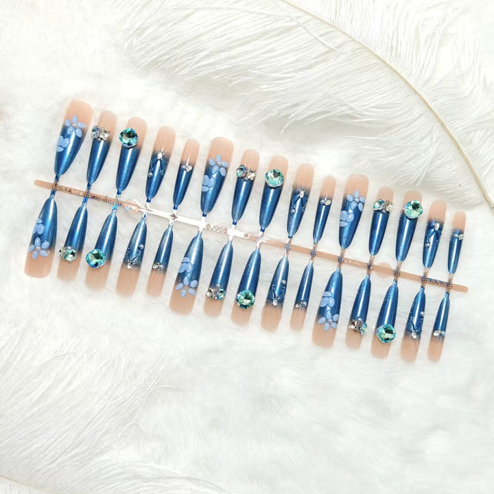 Elegant artificial nails with floral applications and glitter elements Stornfield