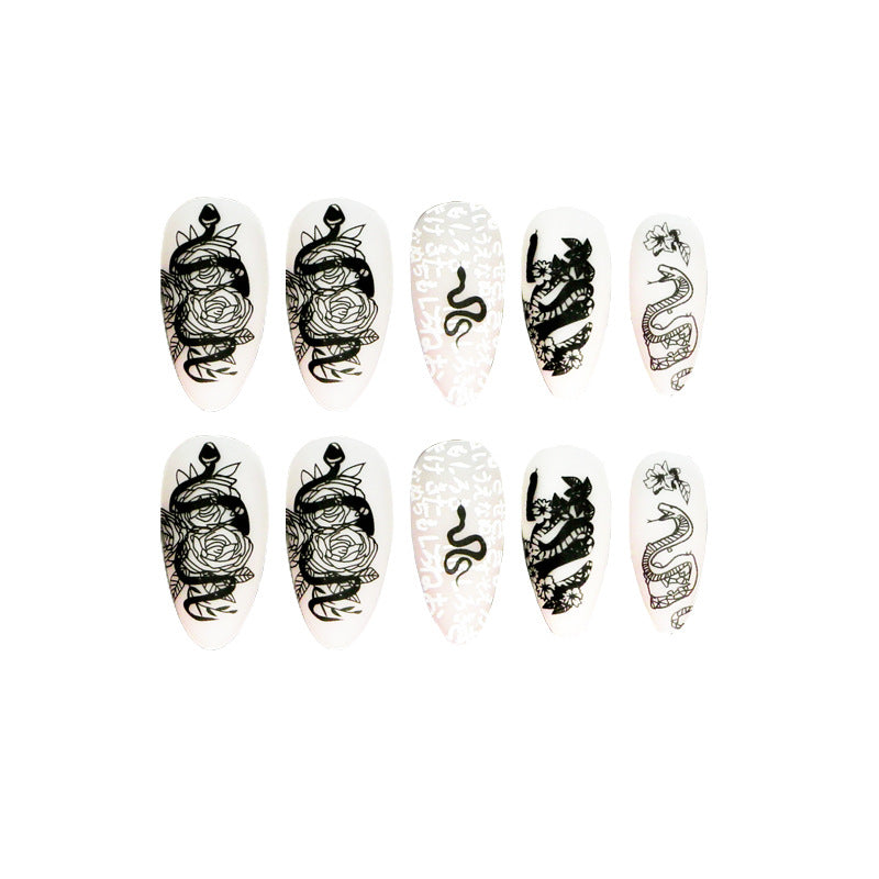 Artful nail extensions in elegant stiletto style with artistic floral and graphic designs Stornfield