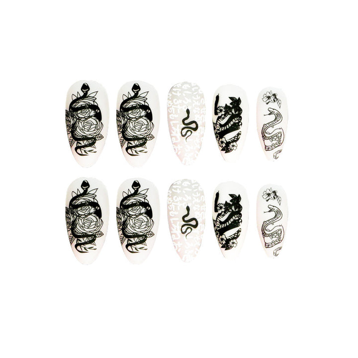 Artful nail extensions in elegant stiletto style with artistic floral and graphic designs Stornfield