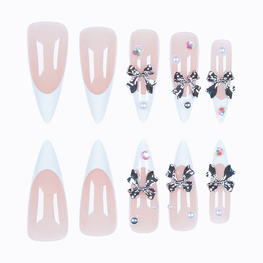 Acrylic nail set with elegant bows and sparkling accents Stornfield