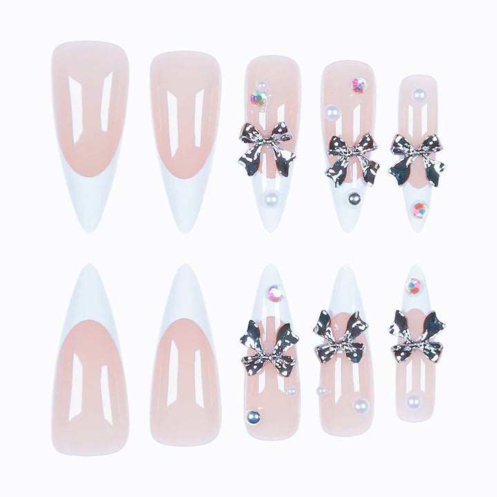 Acrylic nail set with elegant bows and sparkling accents Stornfield