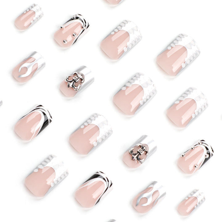 Artistic nail extensions with metallic embellishments Stornfield