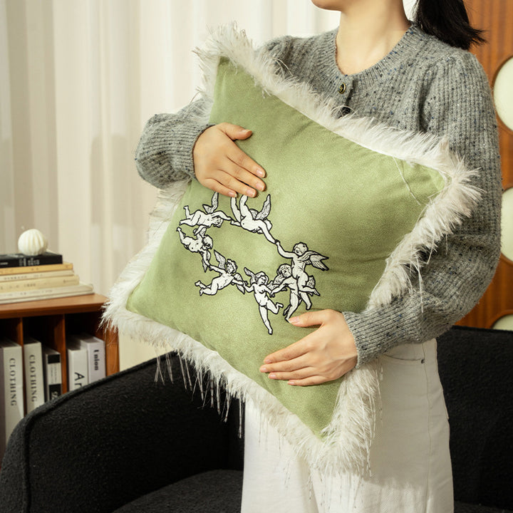 Luxurious decorative velvet cushion with angel embroidery and faux fur trim
