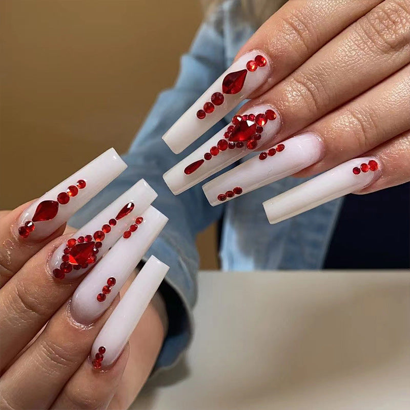 Artful nail extensions with glitter accents and elegant embellishments Stornfield
