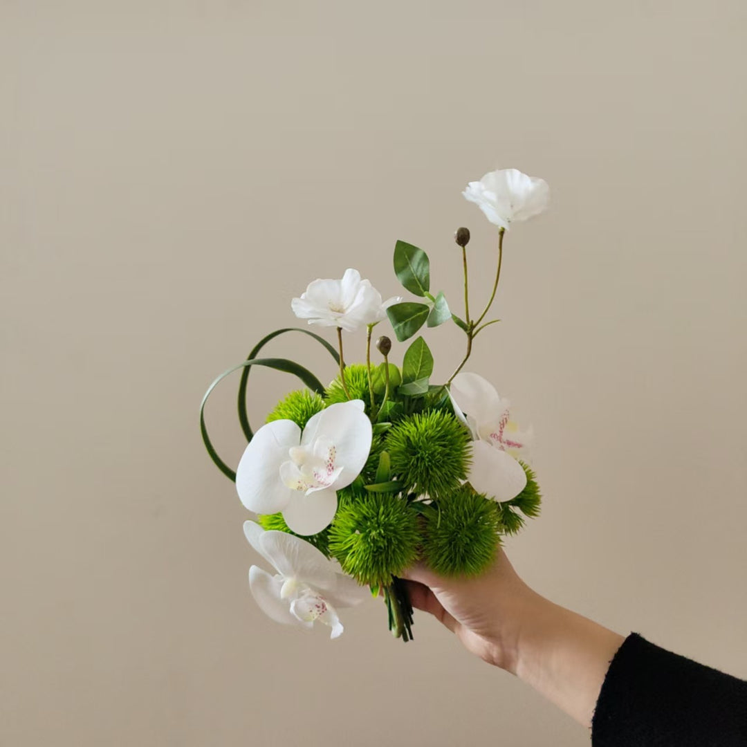Lifelike Orchid and Greenery Floral Arrangement